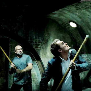 Carlo Rota stars as Charles and Greg Bryk stars as Mallick in Lionsgate Films' Saw V (2008)