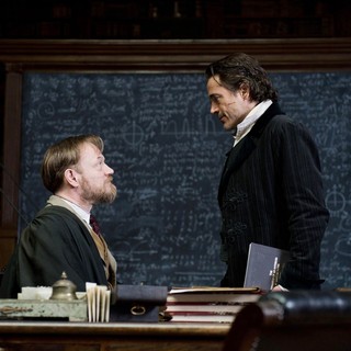 Jared Harris stars as Professor Moriarty and Robert Downey Jr. stars as Sherlock Holmes in Warner Bros. Pictures' Sherlock Holmes: A Game of Shadows (2011)