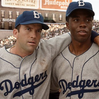Lucas Black stars as Pee Wee Reese and Chadwick Boseman stars as Jackie Robinson in Warner Bros. Pictures' 42 (2013)