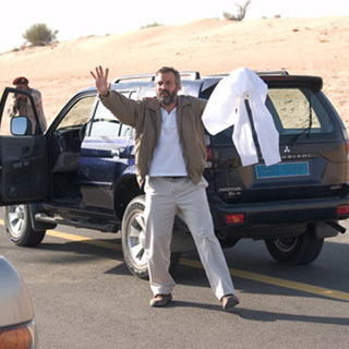 George Clooney as Robert Barnes, a CIA agent in 