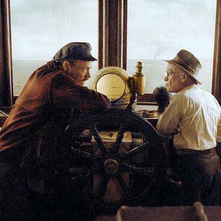 Jared Harris stars as Captain Mike and Brad Pitt stars as Benjamin Button in Paramount Pictures' The Curious Case of Benjamin Button (2008)