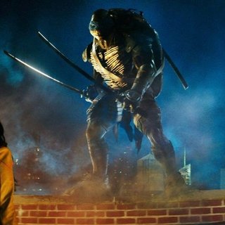 Megan Fox (April O'Neil) and (Leonardo) in Paramount Pictures' Teenage Mutant Ninja Turtles (2014)