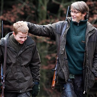 Lasse Fogelstrom stars as Marcus and Mads Mikkelsen stars as Lucas in Magnolia Pictures' The Hunt (2013)