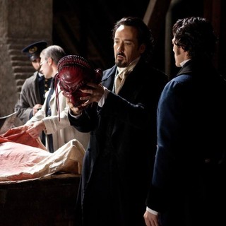 John Cusack stars as Edgar Allan Poe and Luke Evans stars as Detective Emmett Fields in Relativity Media's The Raven (2012)