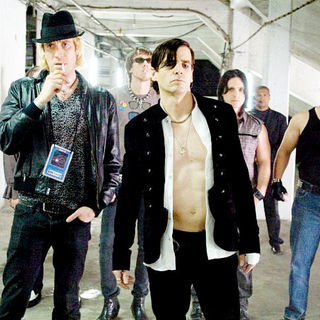 Rhys Ifans stars as Roger and Chris Isaak stars as Les Price in Senator Entertainment's The Informers (2009)