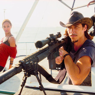 Zoe Saldana stars as Aisha and Oscar Jaenada stars as Cougar in Warner Bros. Pictures' The Losers (2010)