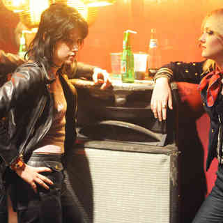 Kristen Stewart stars as Joan Jett and Dakota Fanning stars as Cherie Currie in Apparition's The Runaways (2010)