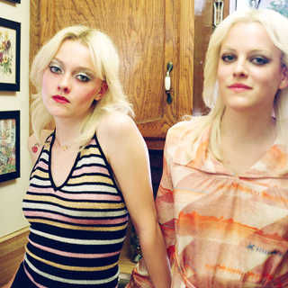 Dakota Fanning stars as Cherie Currie and Riley Keough stars as Marie Currie in Apparition's The Runaways (2010)