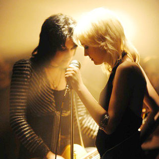 Kristen Stewart stars as Joan Jett and Dakota Fanning stars as Cherie Currie in Apparition's The Runaways (2010)