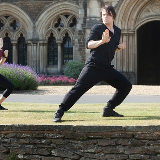 Zoey Deutch stars as Rose Hathaway and Danila Kozlovsky stars as Dimitri Belikov in The Weinstein Company's Vampire Academy (2014). Photo credit by Laurie Sparham.
