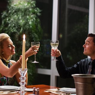 Margot Robbie stars as Naomi Lapaglia and Leonardo DiCaprio stars as Jordan Belfort in Paramount Pictures' The Wolf of Wall Street (2013)