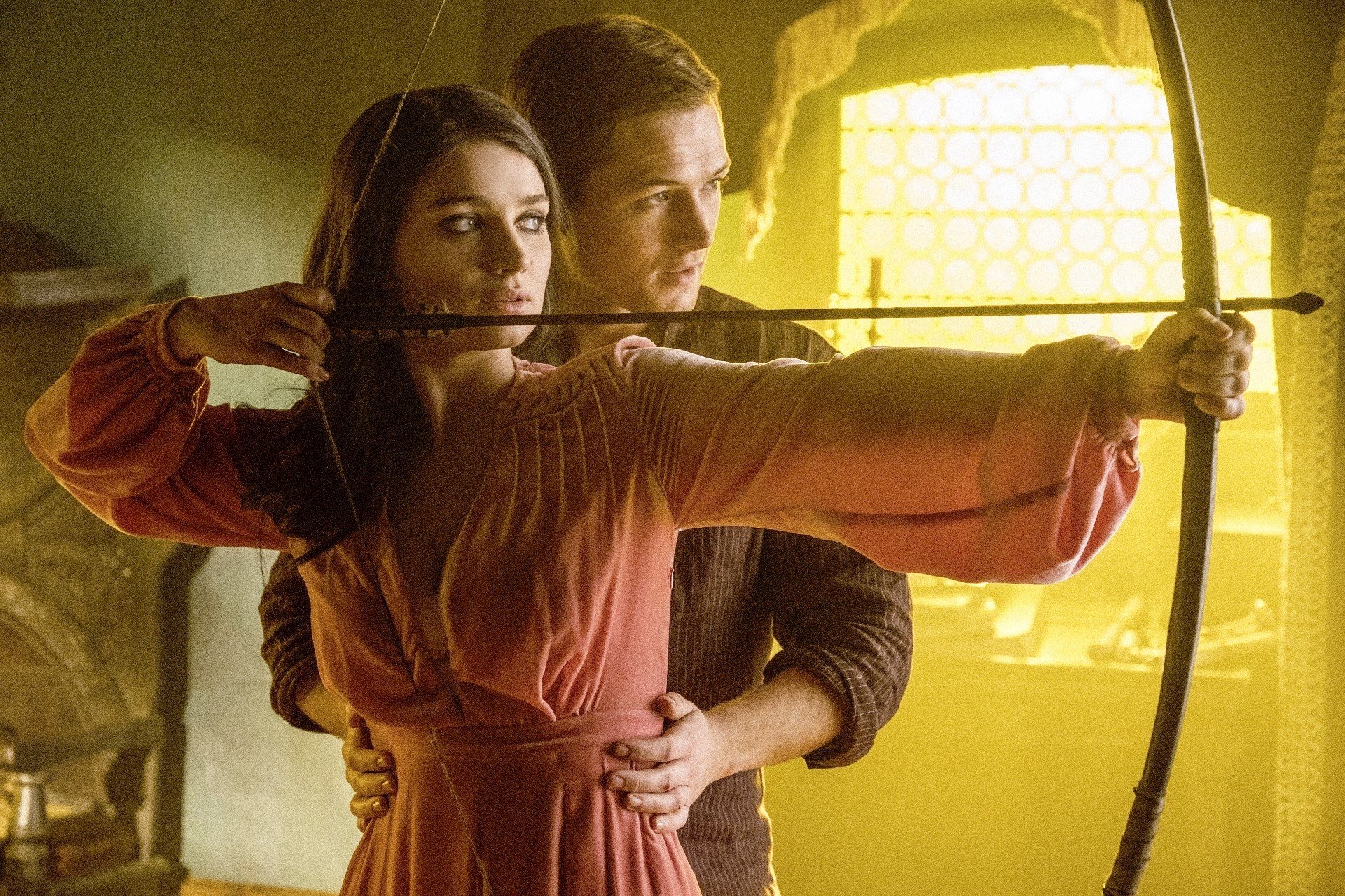 Eve Hewson stars as Maid Marian and Taron Egerton stars as Robin Hood in Lionsgate Films' Robin Hood (2018)