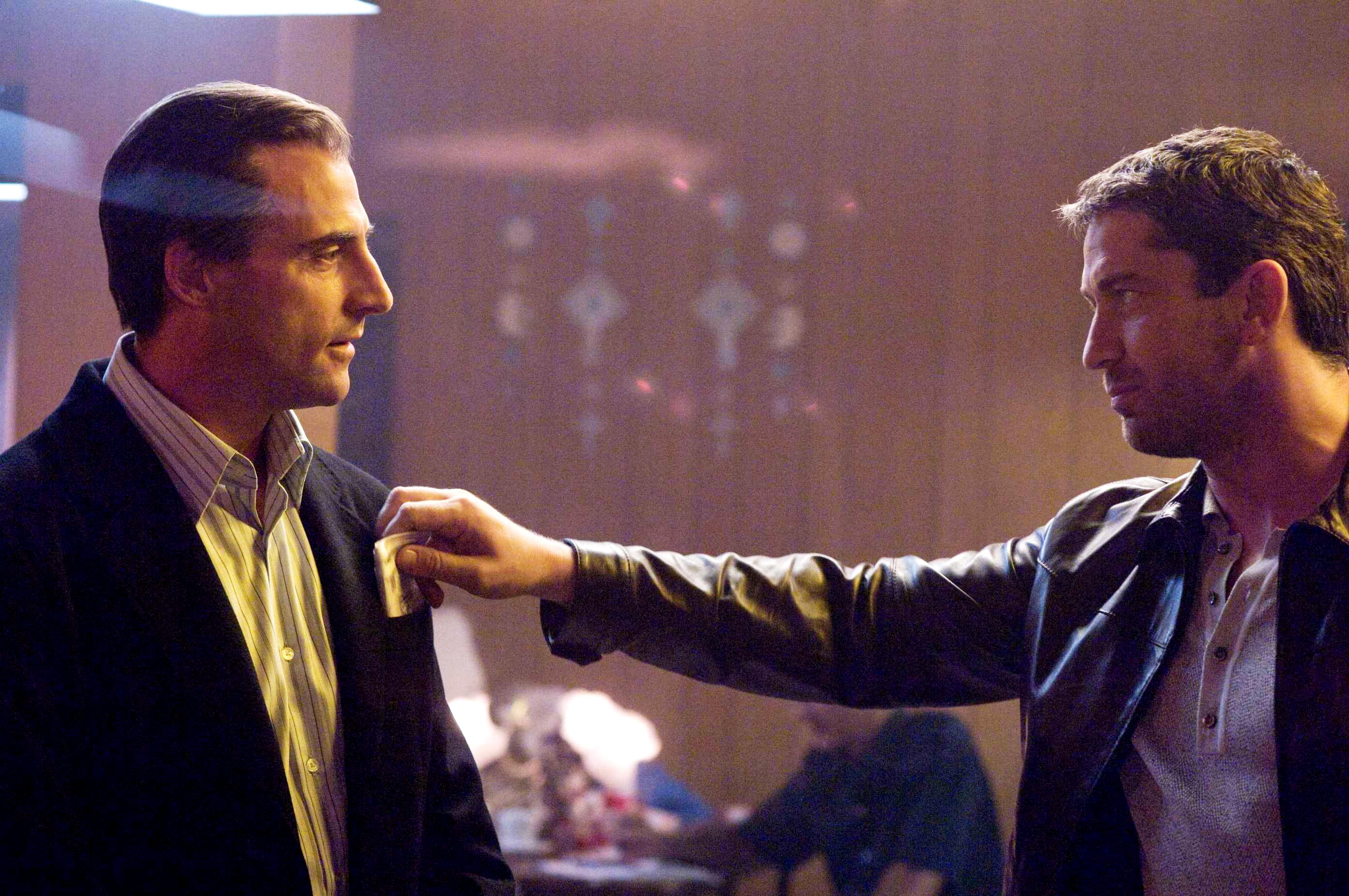 Mark Strong stars as Archie and Gerard Butler stars as One Two in Warner Bros Pictures' RocknRolla (2008). Photo credit by Alex Bailey.