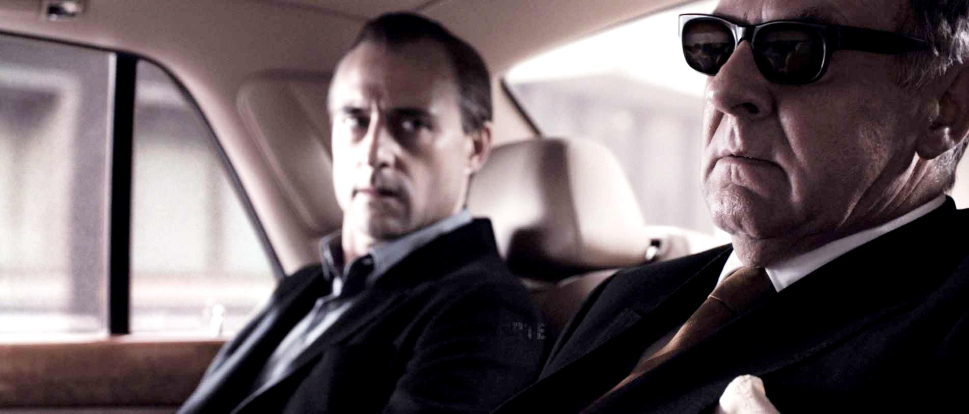 Mark Strong stars as Archie and Tom Wilkinson stars as Lenny Cole in Warner Bros Pictures' RocknRolla (2008)