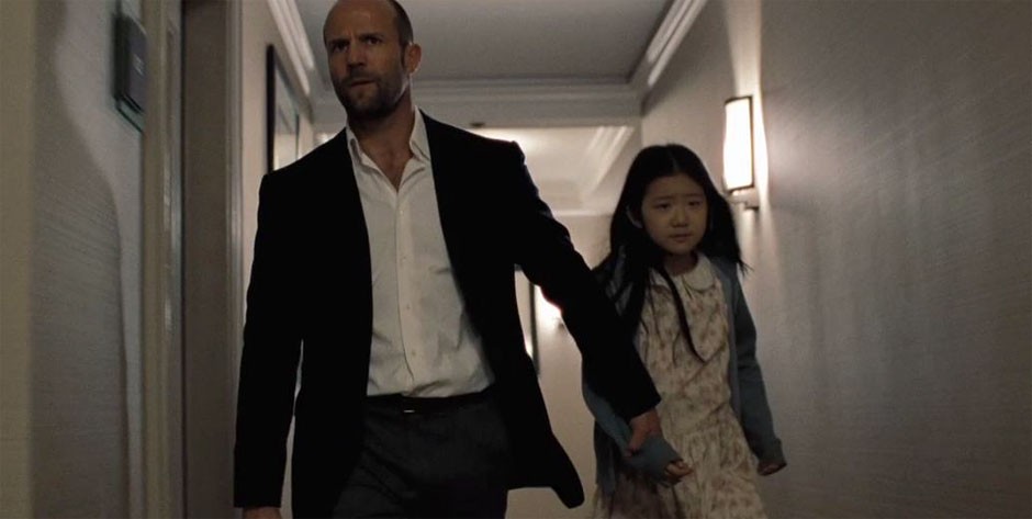 Jason Statham stars as Luke Wright and Catherine Chan stars as Mei in Lionsgate Films' Safe (2012)
