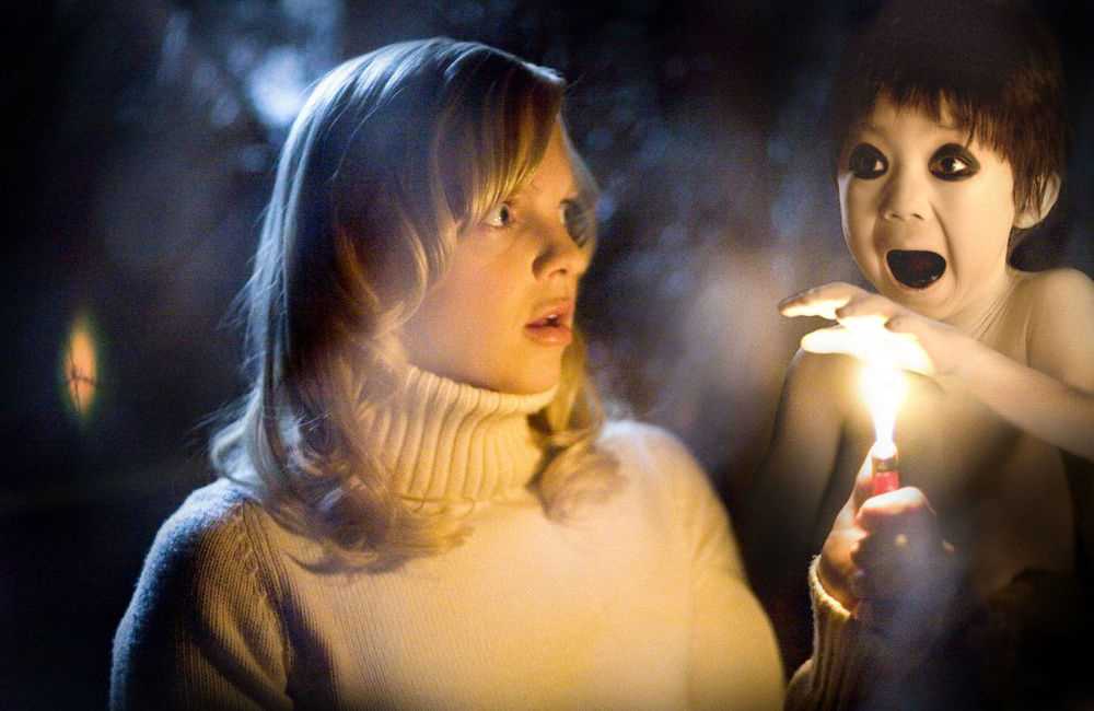 Anna Faris as Cindy Campbell and Garrett Masuda as Japanese ghost boy in Miramax Films' Scary Movie 4 (2006)