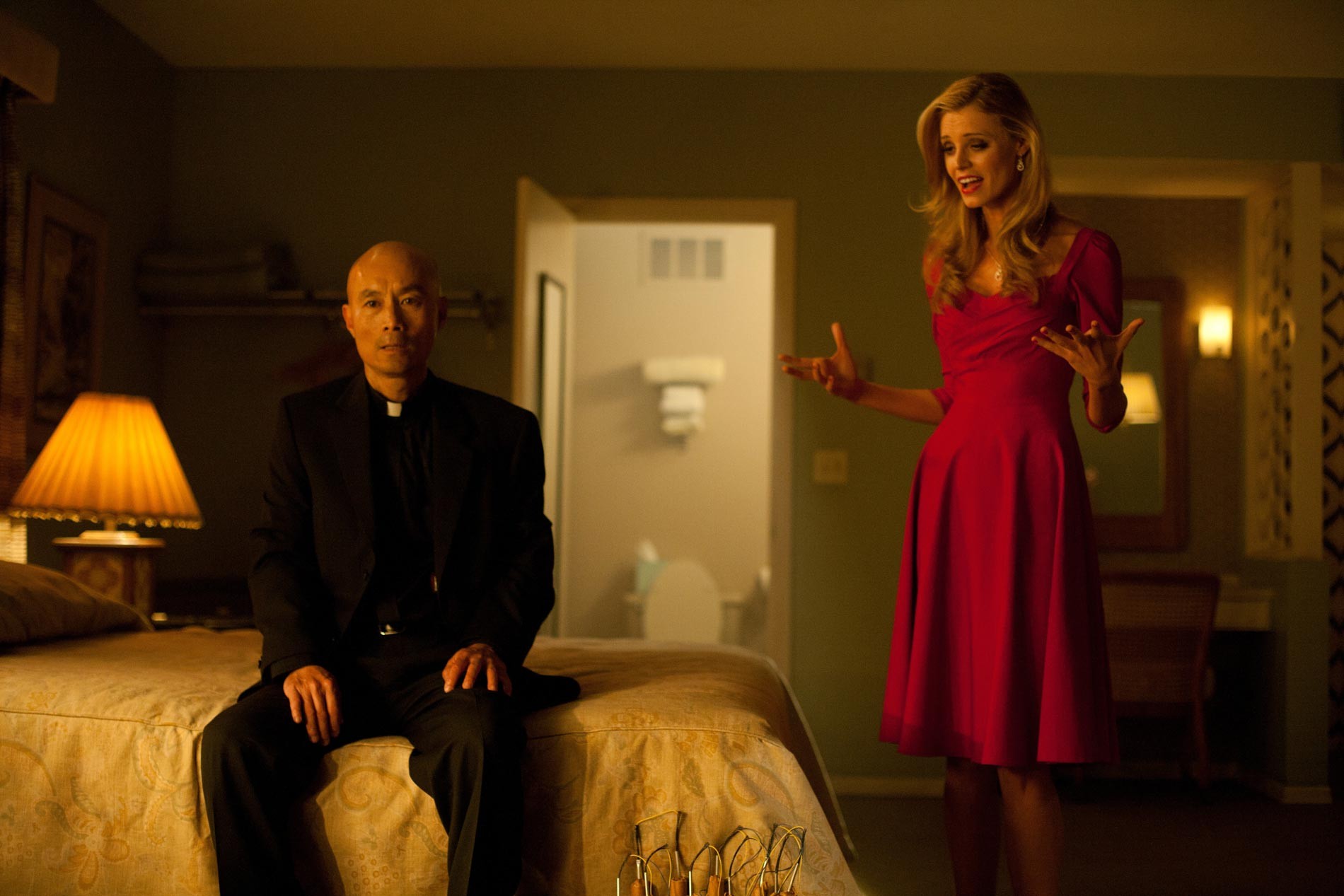 Long Nguyen stars as Vietnamese Priest and Helena Mattsson stars as Blonde Lady in CBS Films' Seven Psychopaths (2012)