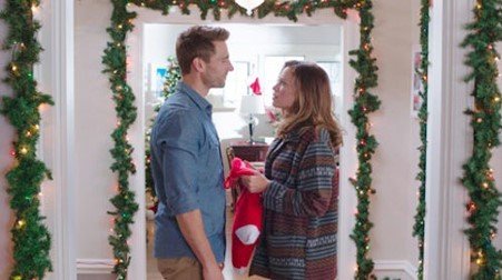 Andrew Walker stars as Kevin Jenner and Bethany Joy Galeotti stars as Jenna Hudson in Lifetime's Snowed-Inn Christmas (2017)