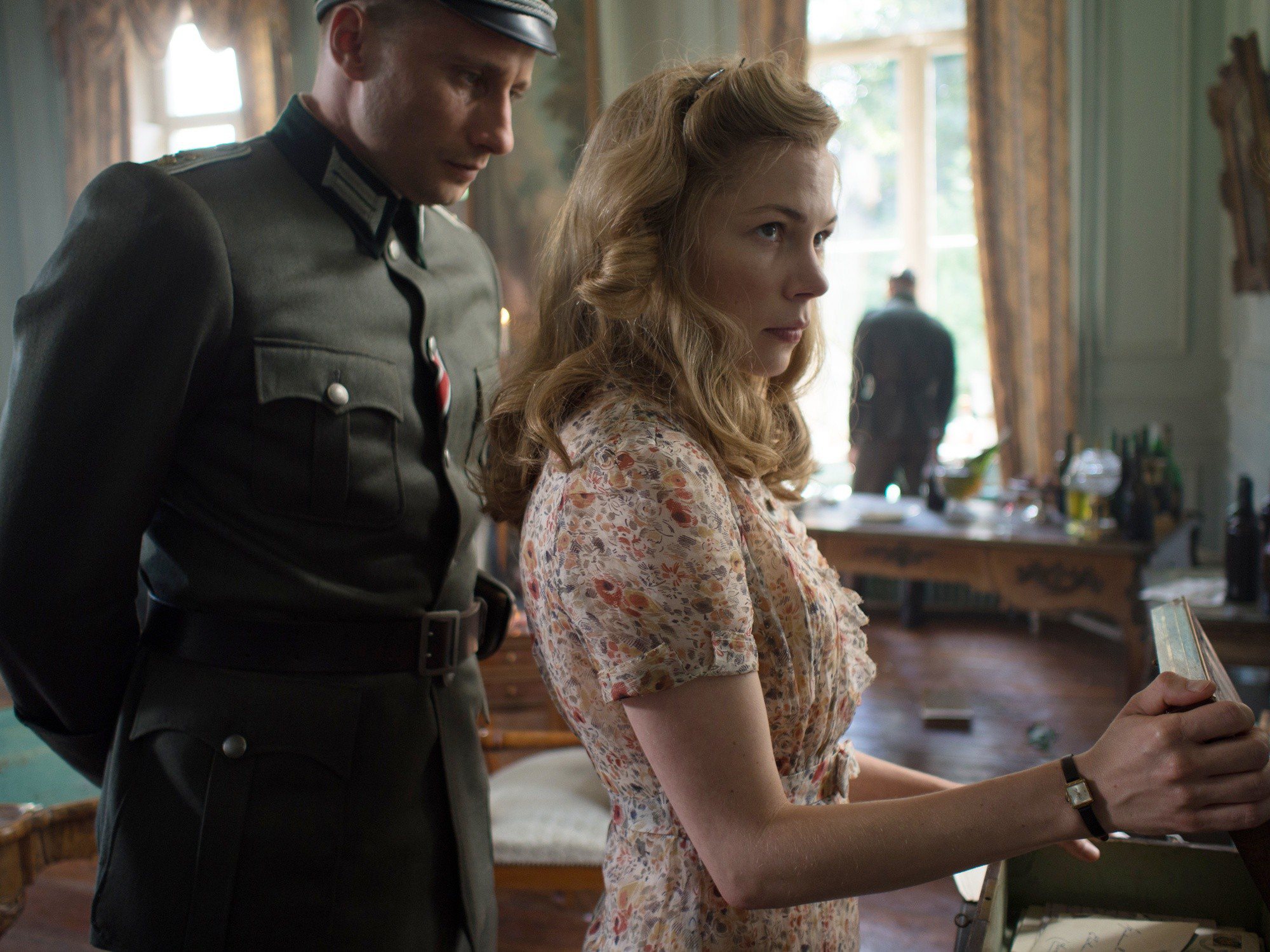 Matthias Schoenaerts stars as Bruno von Falk and Michelle Williams stars as Lucille Angellier in The Weinstein Company's Suite Francaise (2015)