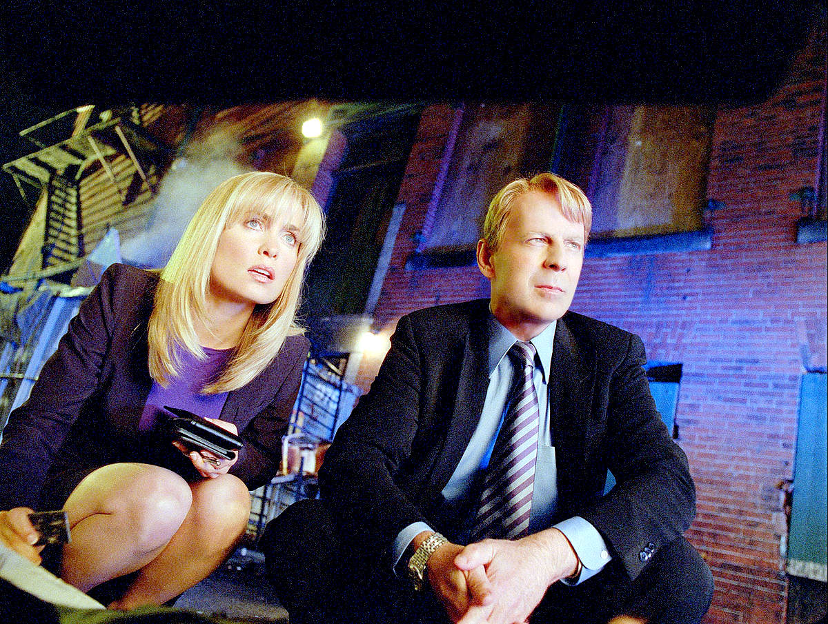 Radha Mitchell stars as Agent Peters and Bruce Willis stars as Agent Greer in Walt Disney Pictures' Surrogates (2009)