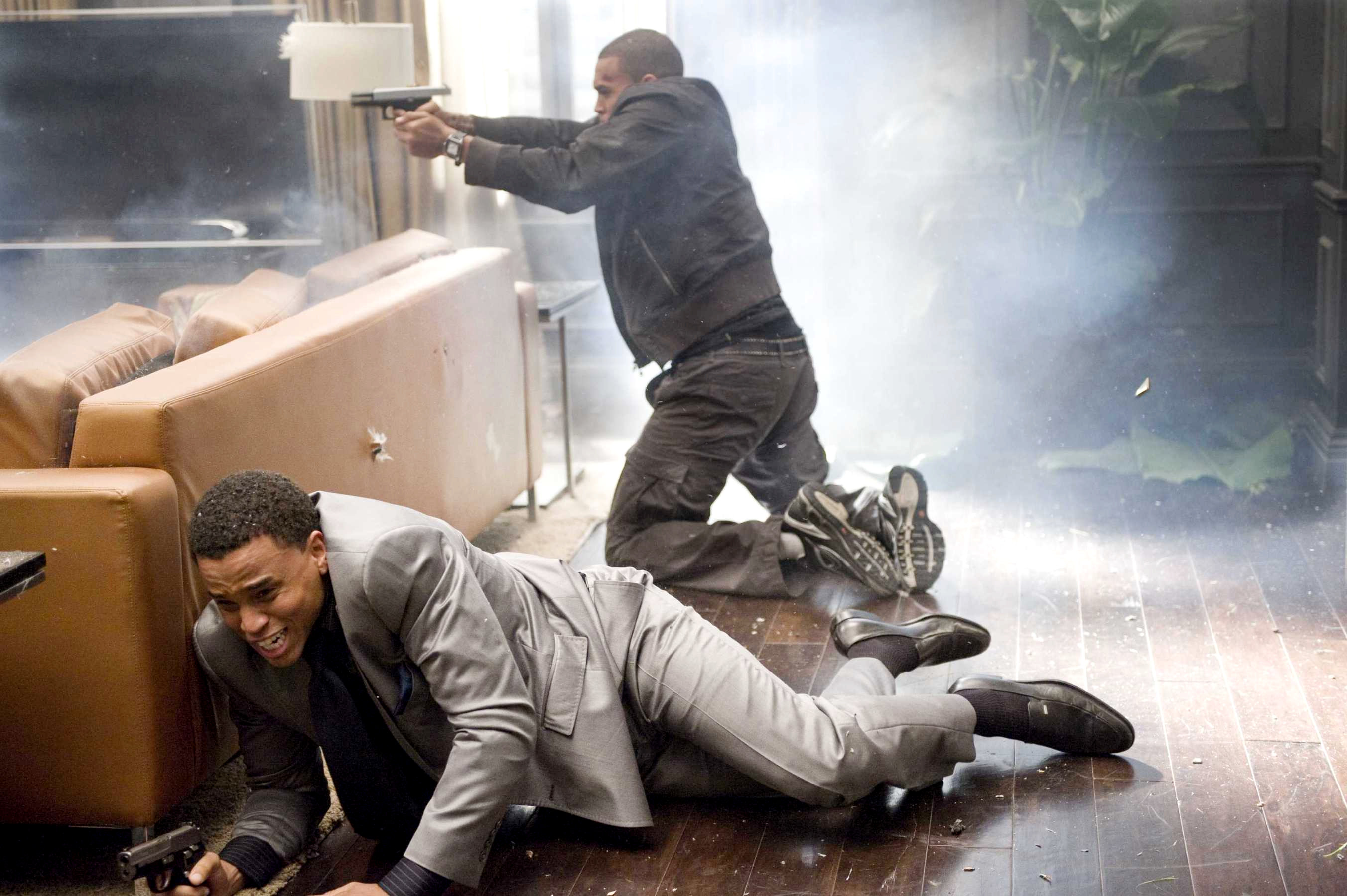 Michael Ealy stars as Jake Attica and Chris Brown stars as Jesse Attica in Screen Gems' Takers (2010)