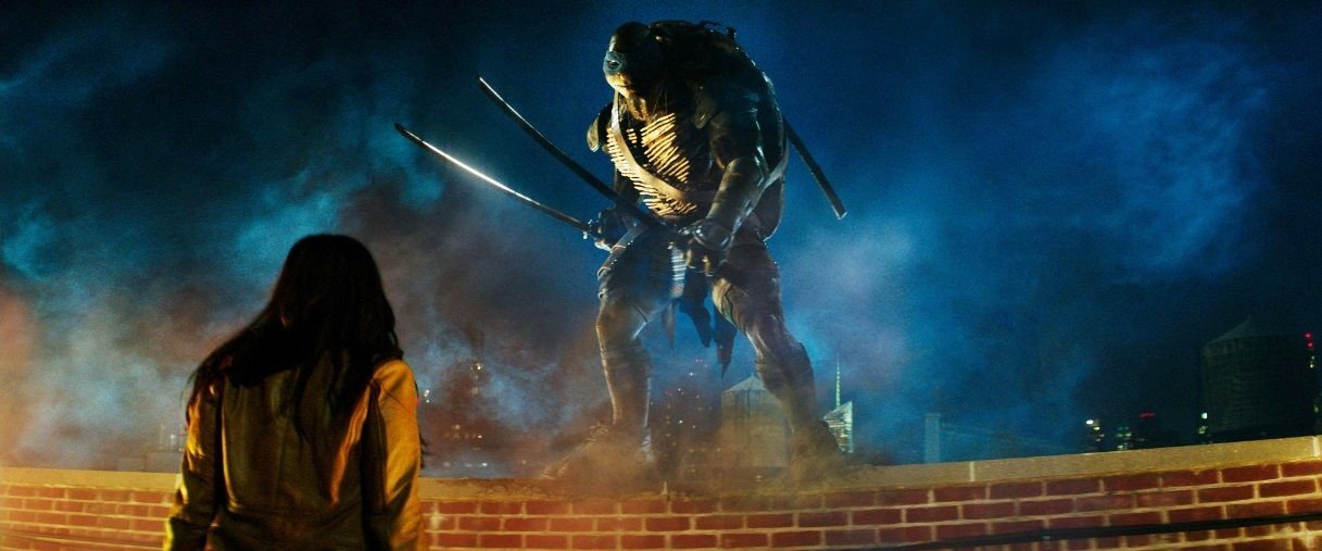 Megan Fox (April O'Neil) and (Leonardo) in Paramount Pictures' Teenage Mutant Ninja Turtles (2014)