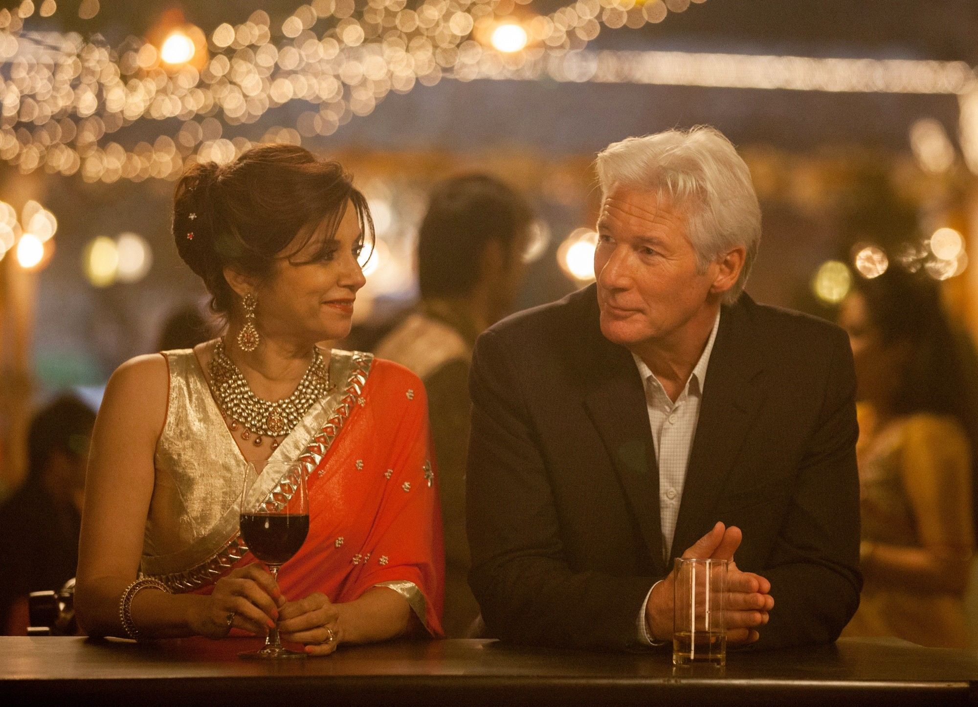 Lillete Dubey stars as Mrs. Kapoor and Richard Gere stars as Guy in Fox Searchlight Pictures' The Second Best Exotic Marigold Hotel (2015). Photo credit by Laurie Sparham.