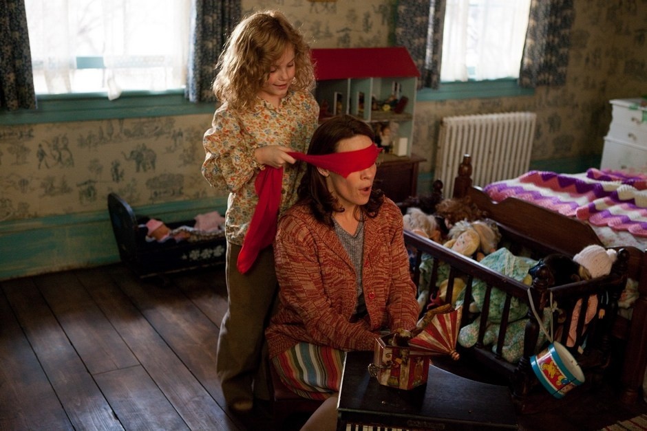 Joey King stars as Christine and Lili Taylor stars a Carolyn Perron in Warner Bros. Pictures' The Conjuring (2013)
