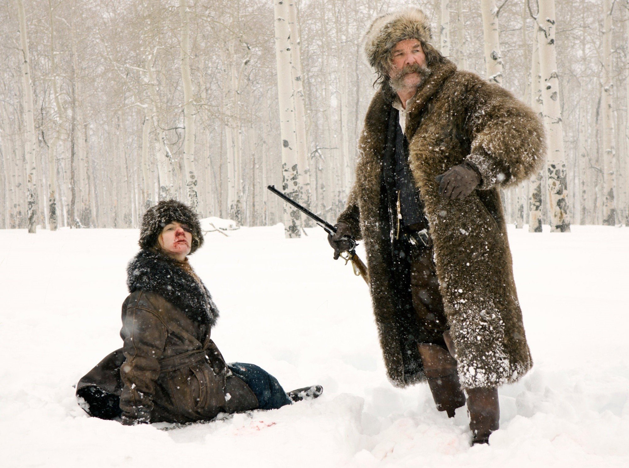 Jennifer Jason Leigh stars as Daisy Domergue and Kurt Russell stars as John Ruth in The Weinstein Company's The Hateful Eight (2015)