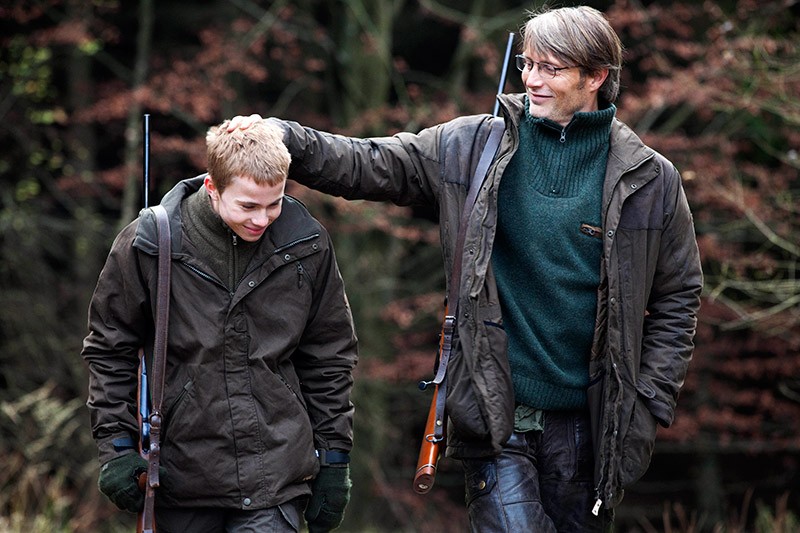 Lasse Fogelstrom stars as Marcus and Mads Mikkelsen stars as Lucas in Magnolia Pictures' The Hunt (2013)