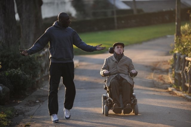 Omar Sy stars as Driss and Francois Cluzet stars as Philippe in The Weinstein Company's The Intouchables (2012)