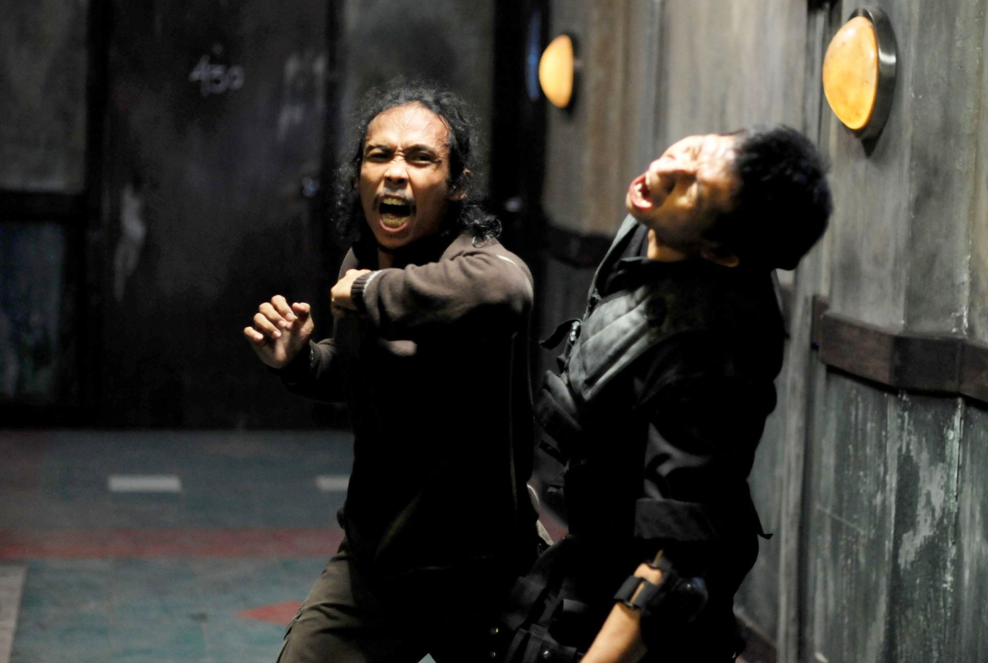 Yayan Ruhian stars as Mad Dog and Eka Rahmadia stars as Dagu in Sony Pictures Classics' The Raid: Redemption (2012). Photo credit by Akhirwan Nurhaidir.