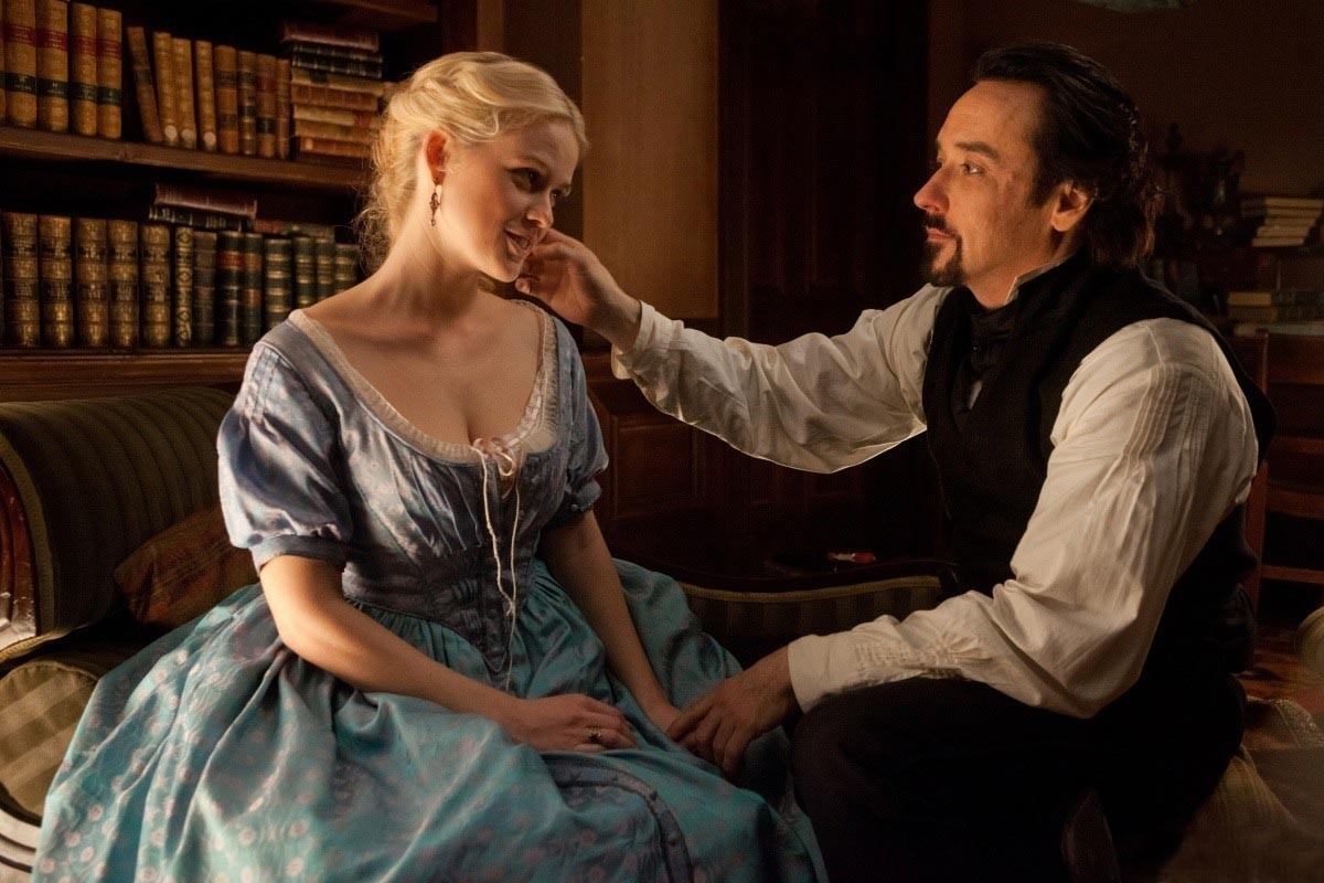 Alice Eve stars as Emily and John Cusack stars as Edgar Allan Poe in Relativity Media's The Raven (2012)
