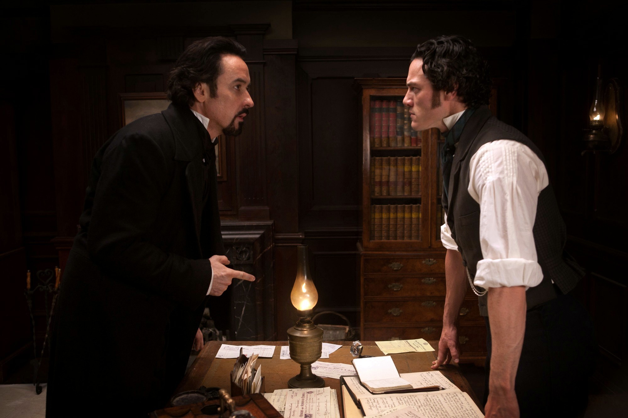 John Cusack stars as Edgar Allan Poe and Luke Evans stars as Detective Emmett Fields in Relativity Media's The Raven (2012)