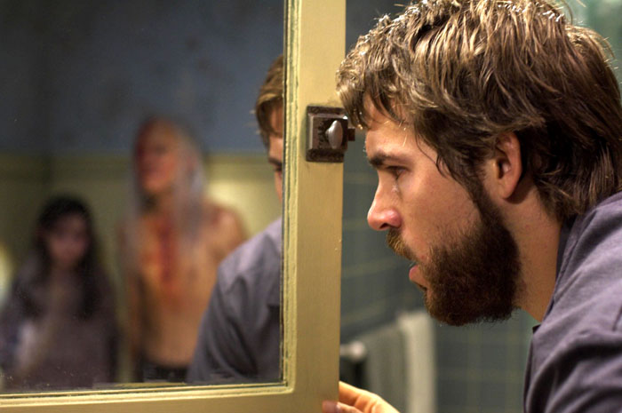 Ryan Reynolds as George Lutz in MGM's The Amityville Horror (2005)