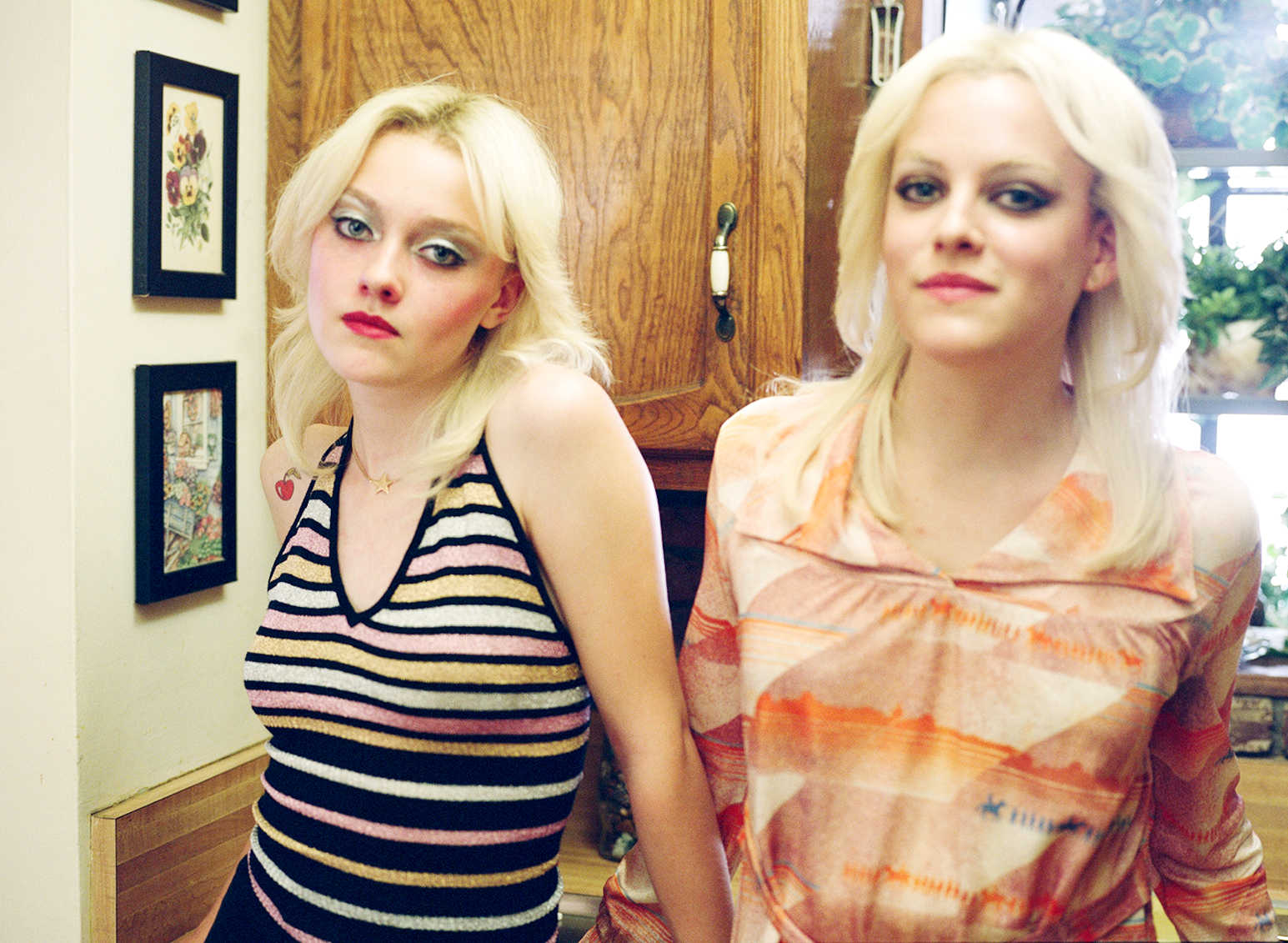 Dakota Fanning stars as Cherie Currie and Riley Keough stars as Marie Currie in Apparition's The Runaways (2010)