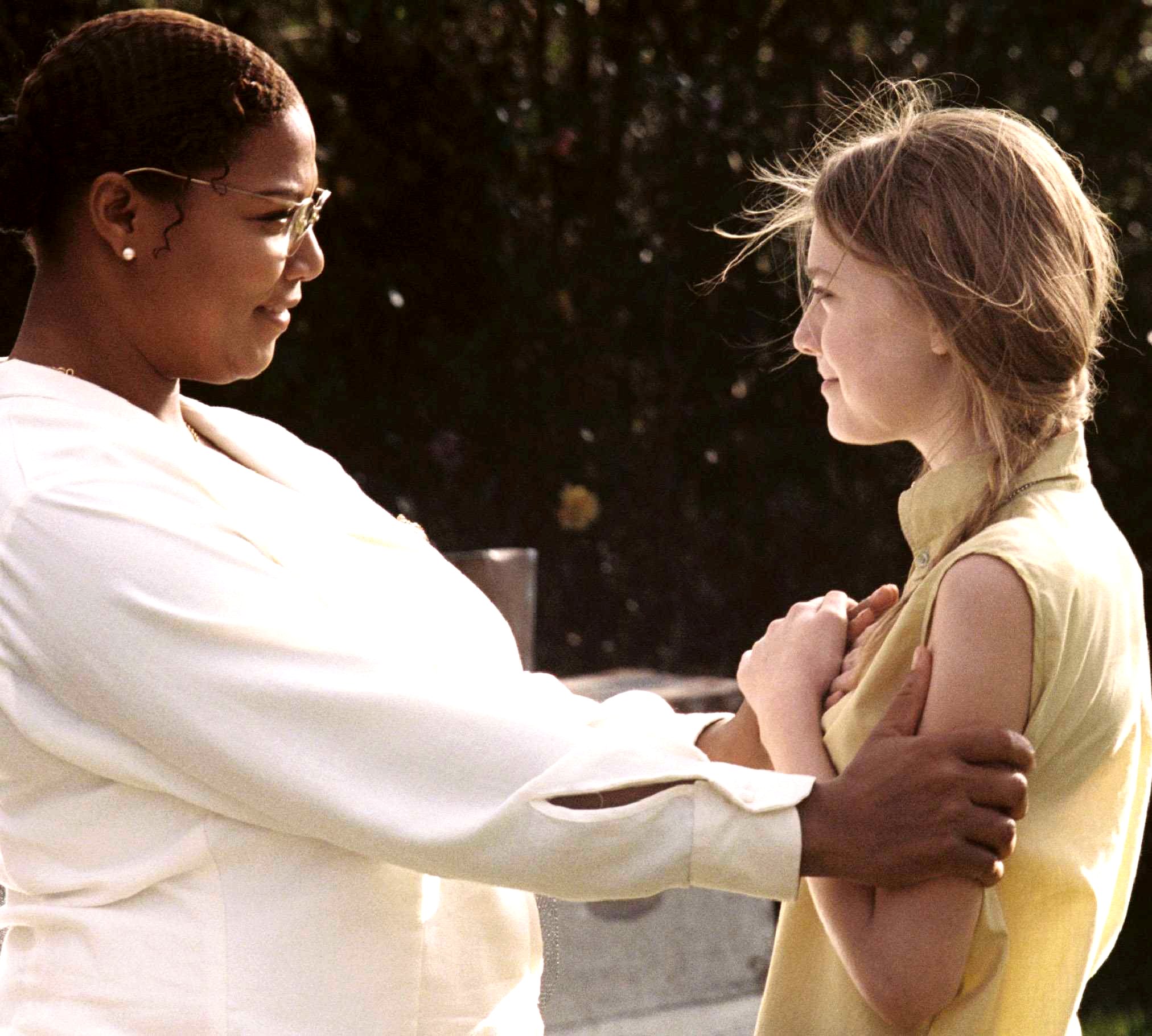 Queen Latifah stars as August Boatwright and Dakota Fanning stars as Lily Owens in Fox Searchlight Pictures' The Secret Life of Bees (2008). Photo credit by Sidney Baldwin.