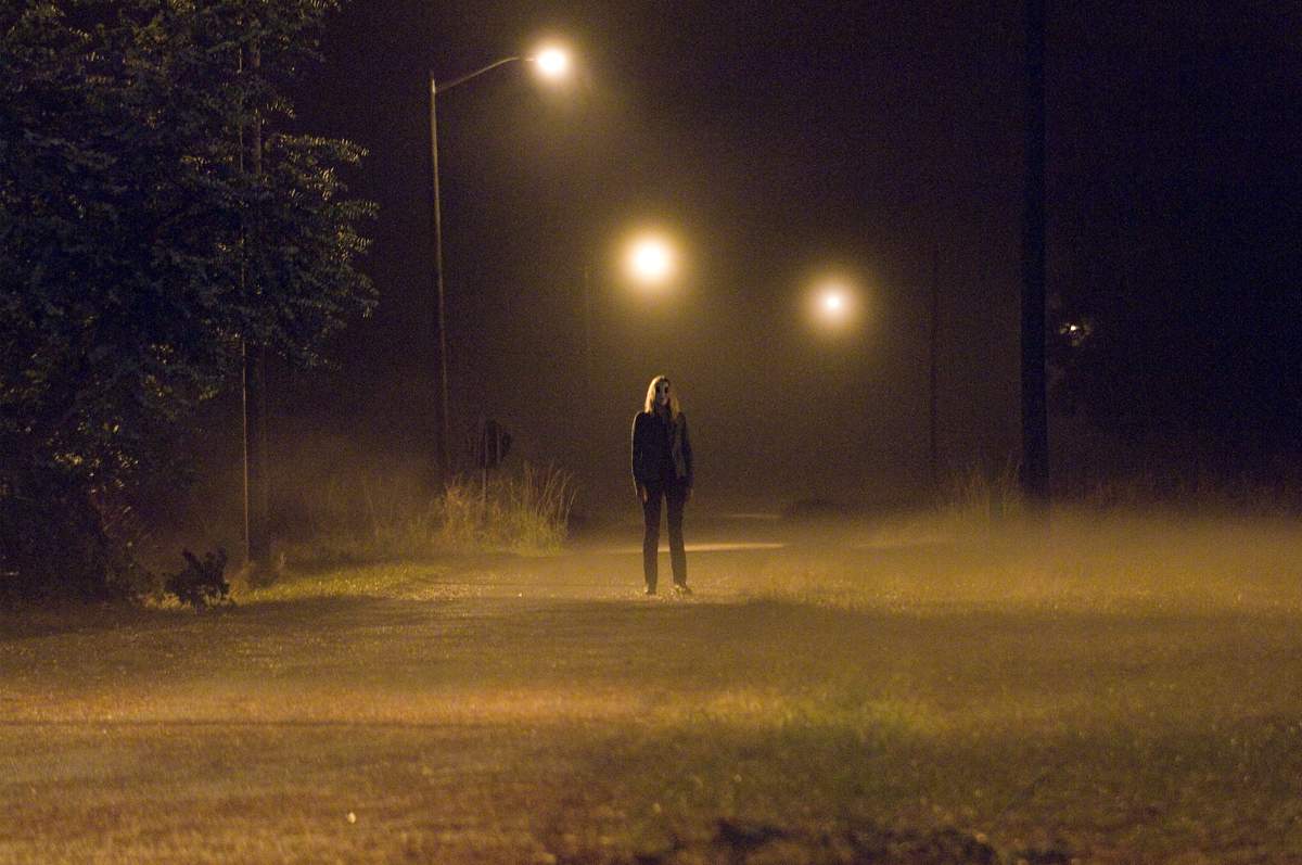 Dollface (GEMMA WARD) silently watches and waits in Rogue Pictures' The Strangers (2008).