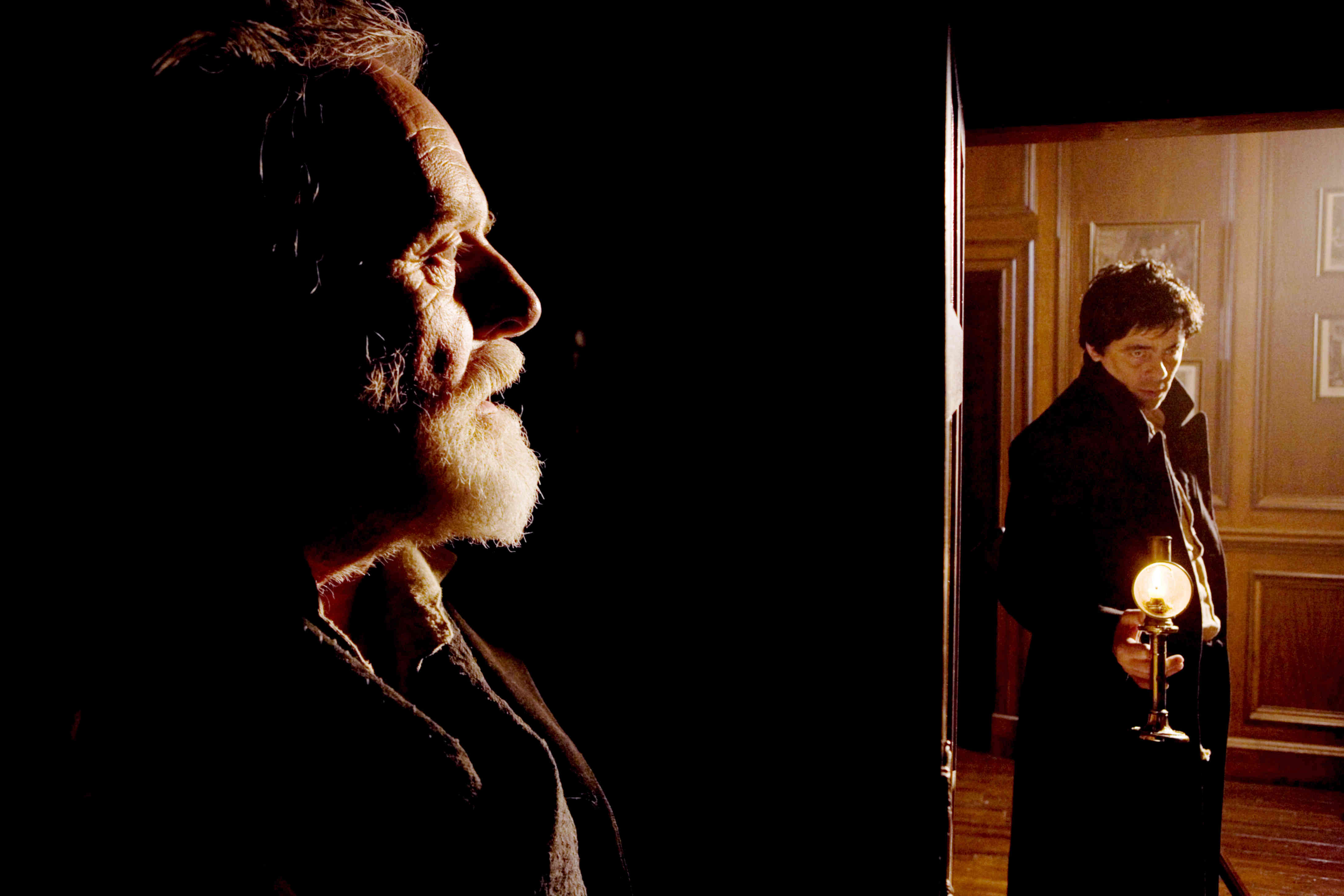 Anthony Hopkins stars as Sir John Talbot and Benicio Del Toro stars as Lawrence Talbot in Universal Pictures' The Wolfman (2009)