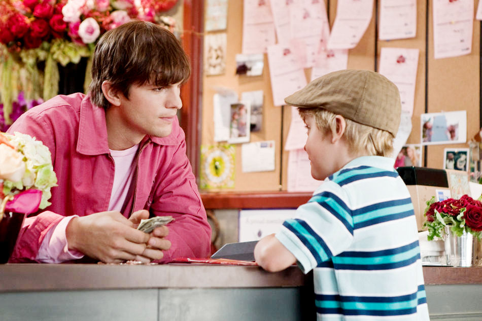Ashton Kutcher stars as Reed Bennett and Bryce Robinson stars as Edison in New Line Cinema's Valentine's Day (2010)
