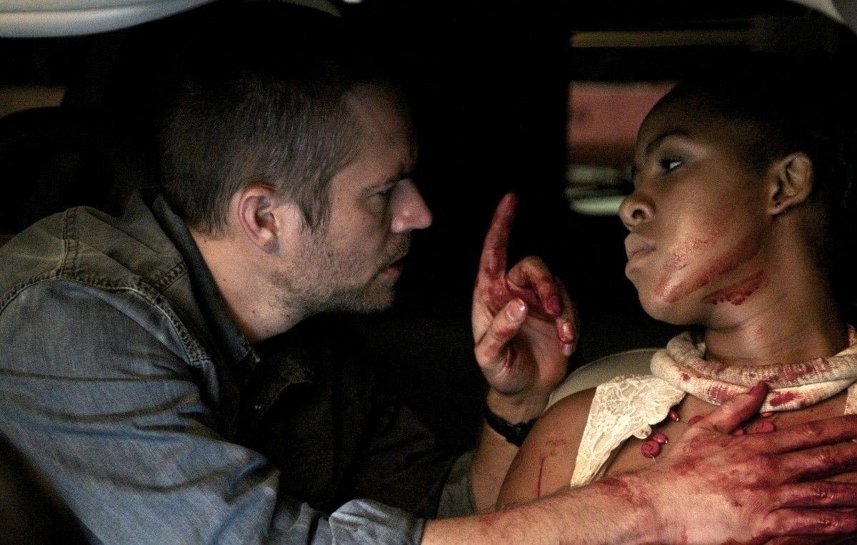 Paul Walker stars as Michael Woods and Naima McLean stars as Rachel Shabangu in Ketchup Entertainment's Vehicle 19 (2013)