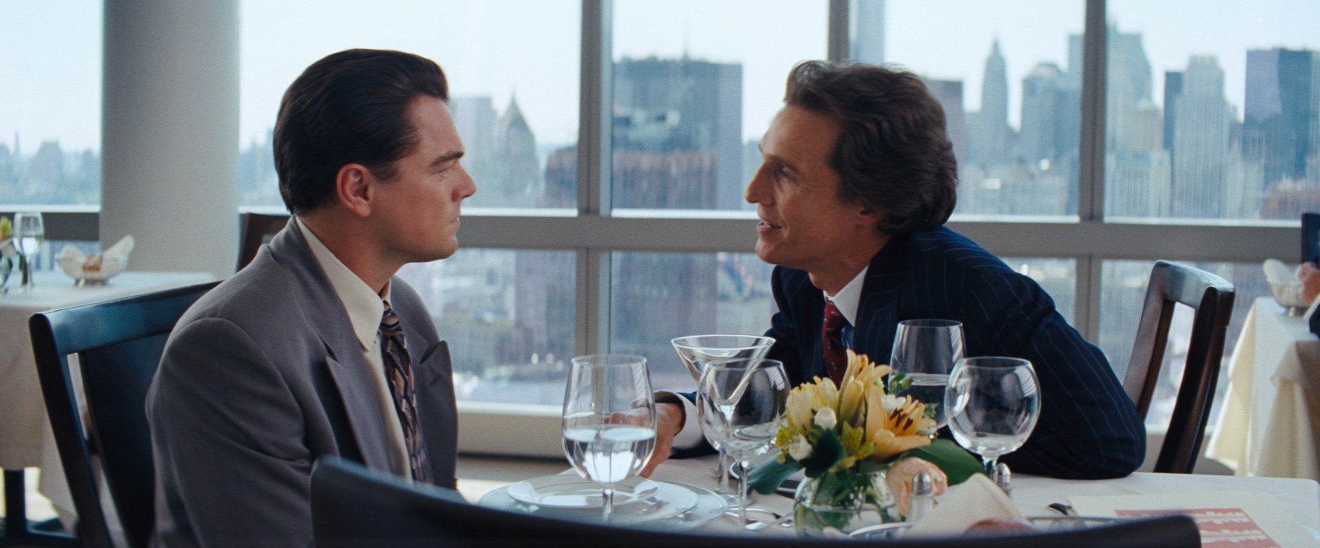Leonardo DiCaprio stars as Jordan Belfort and Matthew McConaughey stars as Mark Hanna in Paramount Pictures' The Wolf of Wall Street (2013)