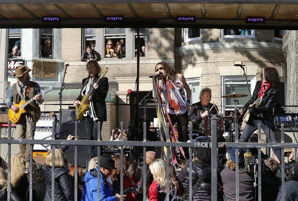Aerosmith;<br>Aerosmith Perform in Front of 1325 Commonwealth Ave, Which Was Their Home in The Early 1970's