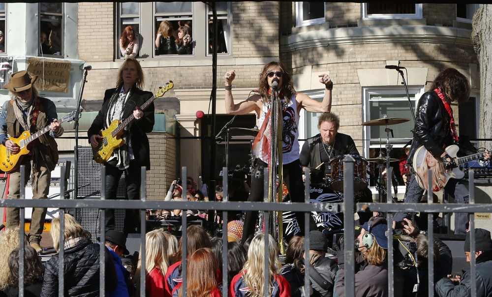 Aerosmith;<br>Aerosmith Perform in Front of 1325 Commonwealth Ave, Which Was Their Home in The Early 1970's