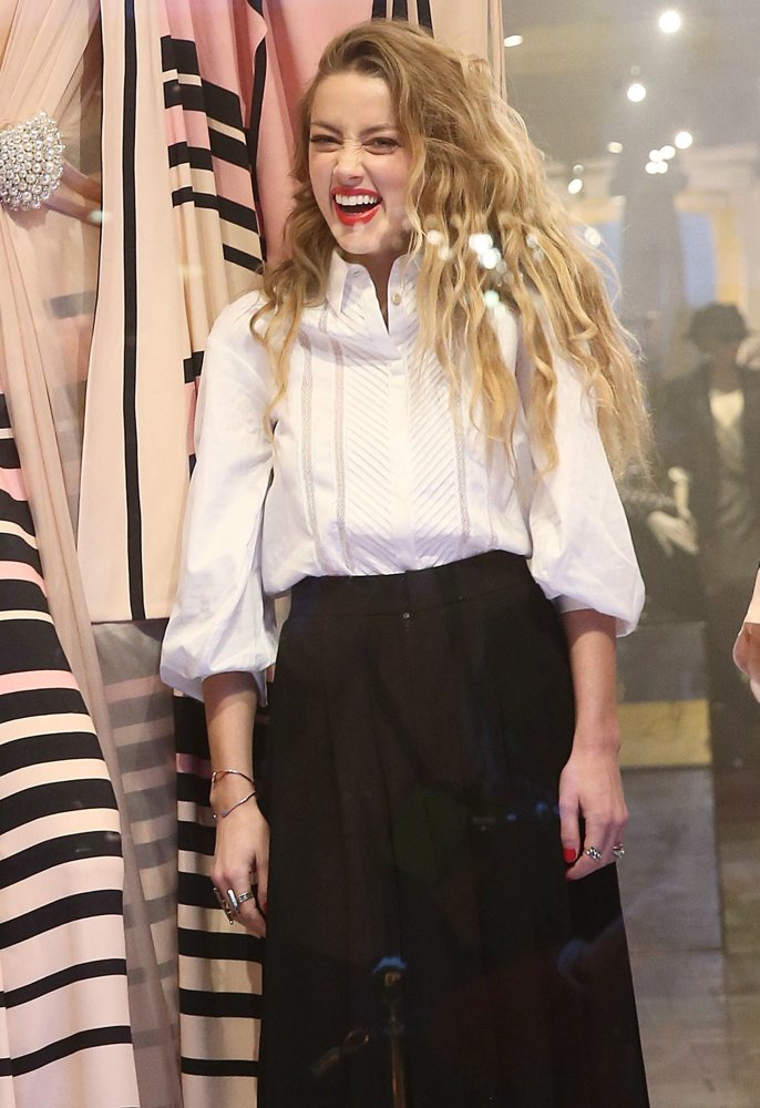 Amber Heard Unveils The Alice in Wonderland Themed Window for Temperley