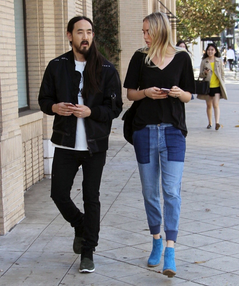 Steve Aoki and Tiernan Cowling Cross A Street in Beverly Hills