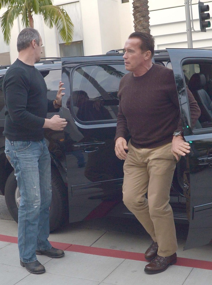 Arnold Schwarzenegger Heads to Prada on Christmas Eve