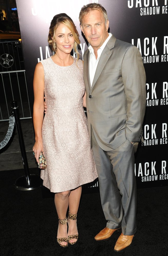 Christine Baumgartner;Kevin Costner;<br>Los Angeles Premiere of Jack Ryan: Shadow Recruit - Red Carpet Arrivals