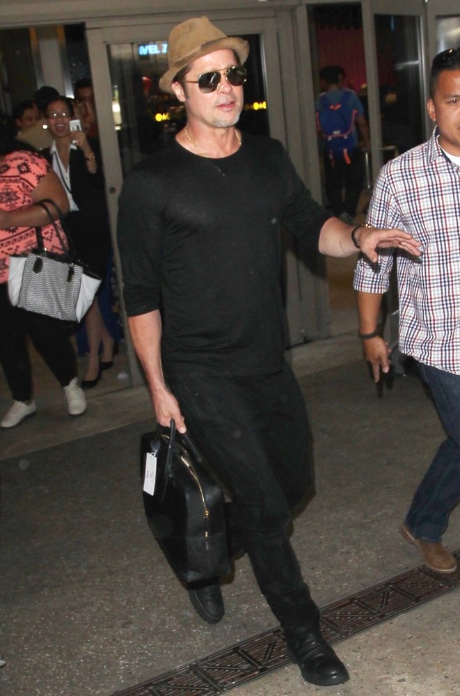 Brad Pitt Arrives at Los Angeles International Airport