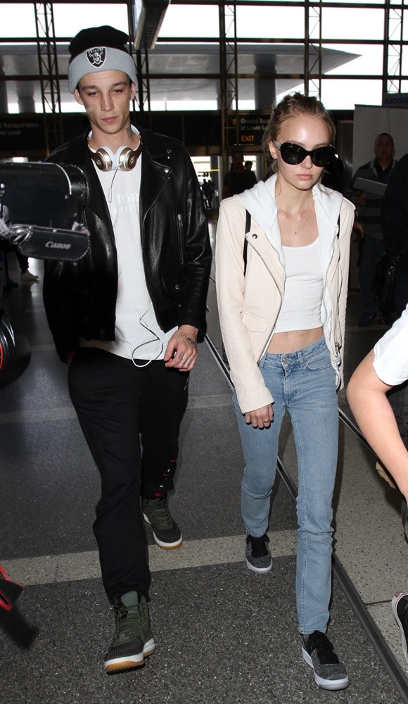 Lily-Rose Depp and Ash Stymest Arrive at Los Angeles International Airport